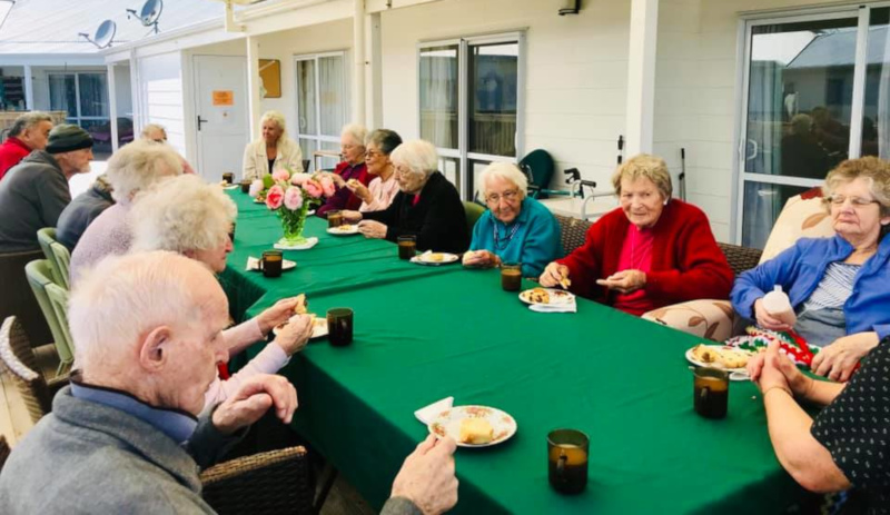 Cairnfield House residents at a table outside.