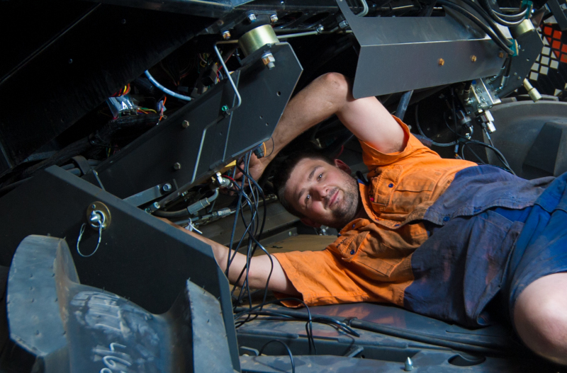 Agg-Tech Machinery mechanic working on a vehicle.