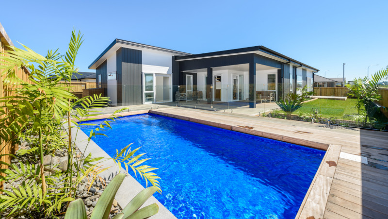 Barrett Homes Terrace View show home with pool in foreground.