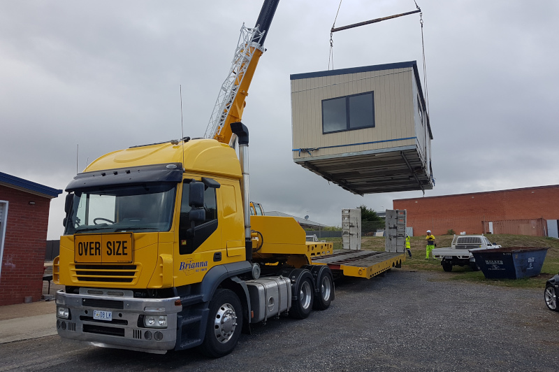 Brianna Tilt Trays & Towing Pty Ltd. structure being loaded for transport.